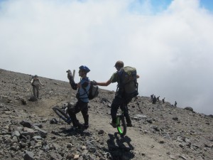 Unicyclists coming down Mt. Taranaki